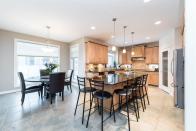 <p><span>19 Kingsford Cres., St. Albert, Alta.</span><br>The kitchen has granite countertops, dual ovens, gas range and a large pantry.<br>(Photo: Zoocasa) </p>