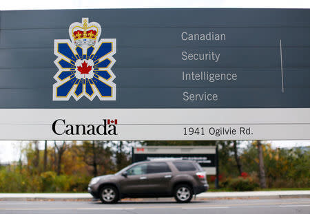 FILE PHOTO - A vehicle passes a sign outside the Canadian Security Intelligence Service (CSIS) headquarters in Ottawa, Canada on November 5, 2014. REUTERS/Chris Wattie/File Photo