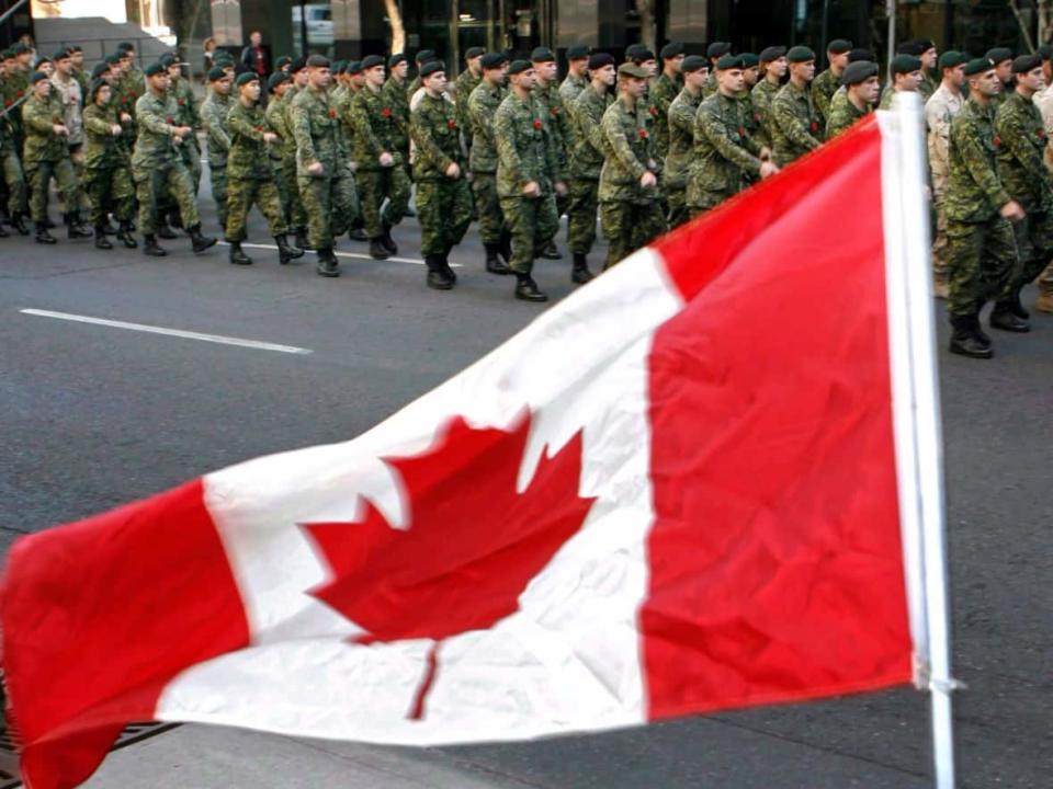 Members of Canada's military parade through downtown Calgary, Saturday, Nov. 1, 2008. A new military housing benefit is not going over very well with some members. (Jeff McIntosh/Canadian Press - image credit)