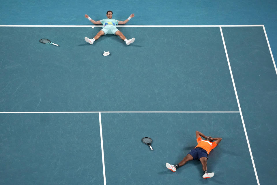 Rohan Bopanna of India and Matthew Ebden, top, of Australia celebrate after defeating Simone Bolelli and Andrea Vavassori of Italy in the men's doubles final the Australian Open tennis championships at Melbourne Park, Melbourne, Australia, Saturday, Jan. 27, 2024. (AP Photo/Louise Delmotte)