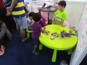 Children playing with blocks and shapes.