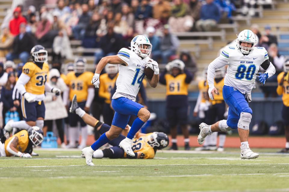 David Durden breaks a long run after the catch against Mississippi College on November 12, 2022. Photo Credit: Morgan Givens/ UWF Athletics