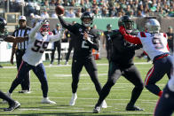 New York Jets quarterback Zach Wilson (2) passes against the New England Patriots during the first quarter of an NFL football game, Sunday, Oct. 30, 2022, in New York. (AP Photo/Noah Murray)