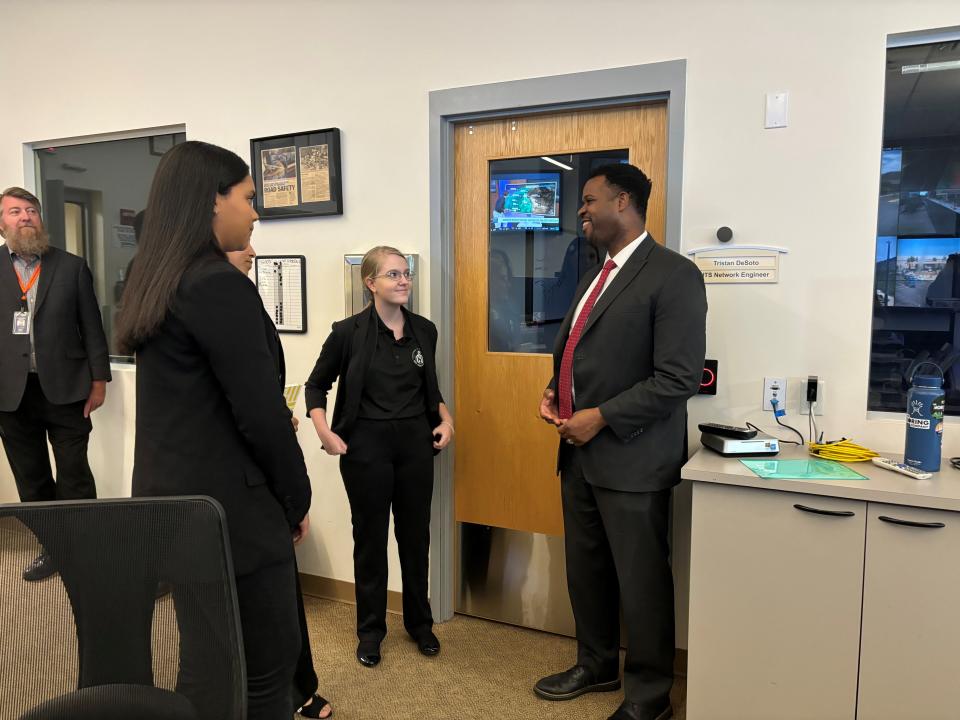 Robert Hampshire, deputy assistant secretary for research and technology for the U.S. Department of Transportation, speaks with students while touring the Maricopa County Traffic Management Center in April 2024.