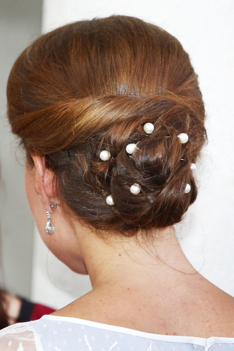 <p>Kate accessorized her low bun with pearl-tipped bobby pins. </p>