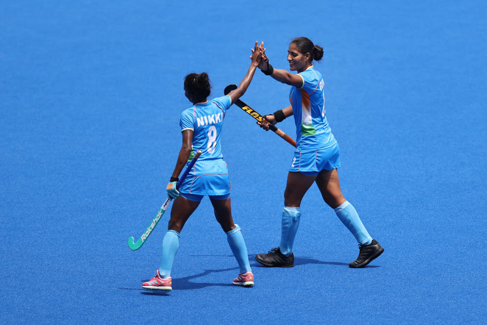 TOKYO, JAPAN - AUGUST 02: Gurjit Kaur of Team India celebrates scoring the first goal with Nikki Pradhan during the Women's Quarterfinal match between Australia and India on day ten of the Tokyo 2020 Olympic Games at Oi Hockey Stadium on August 02, 2021 in Tokyo, Japan. (Photo by Buda Mendes/Getty Images)