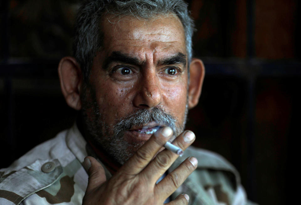 An Iraqi soldier smokes a cigarette