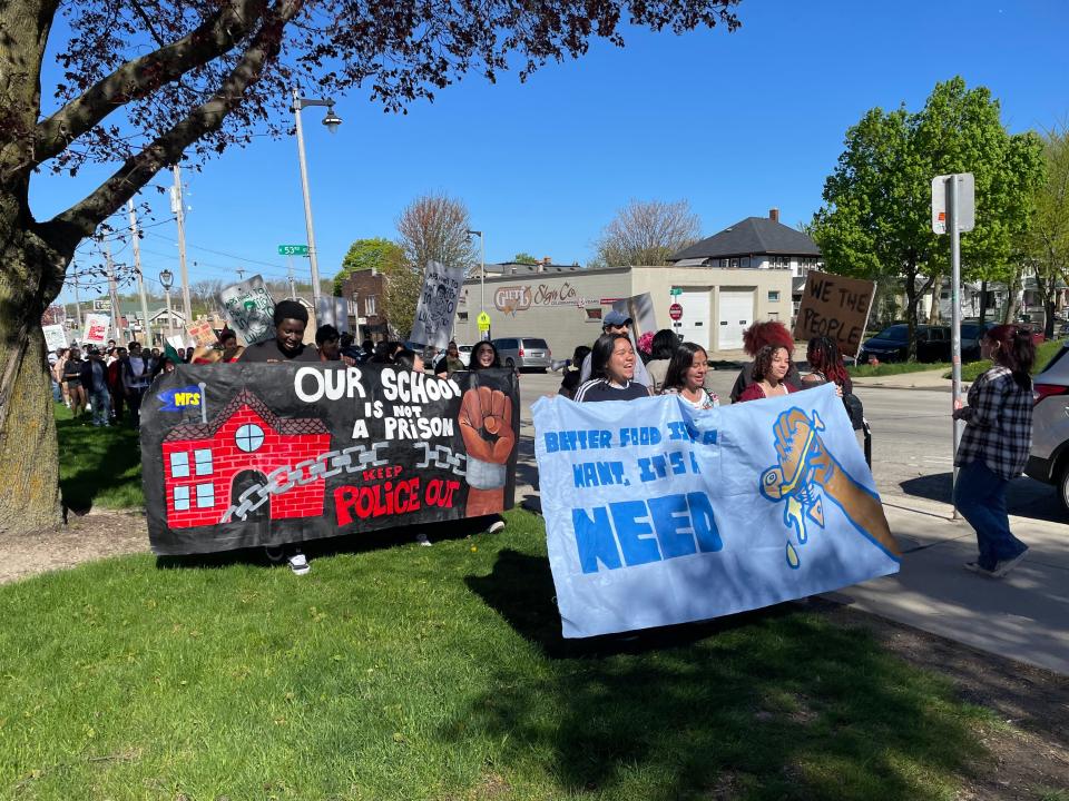 Brianna Amaro-Perez, Maricela Hernandez Chavez and Korianyelis Torres Camacho, all 15-year-old students at Riverside High School, hold a banner that says, "Better food isn't a want, it's a need," as they picket outside Milwaukee Public Schools' central office May 1.