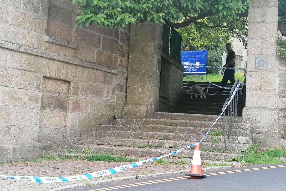 Police tape around the steps of St Michael's Church after the alleged incident last July <i>(Image: NQ)</i>