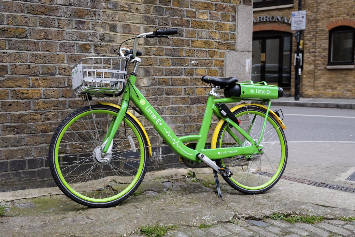 A Lime E dockless Electric Bicycle is seen on a street in east London, England on April 29, 2019. The Green pay as you ride bikes called Lime-E which are backed by Uber and Google can be found and unlocked via a mobile phone application. (photo by Vickie Flores/In Pictures via Getty Images)