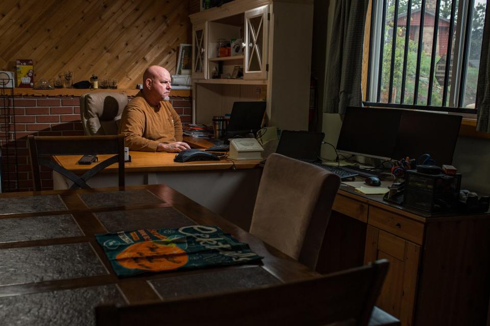 Rich Marr works on an office computer at his Red Feather Lakes business, Marr's Mountain Cabins and Tavern, on June 7, 2023. He and his wife, Kerrie, use Starlink to access the internet.