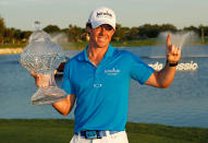 PALM BEACH GARDENS, FL - MARCH 04: Rory McIlroy of Northern Ireland poses with the trophy after winning the Honda Classic at PGA National on March 4, 2012 in Palm Beach Gardens, Florida. (Photo by Mike Ehrmann/Getty Images)