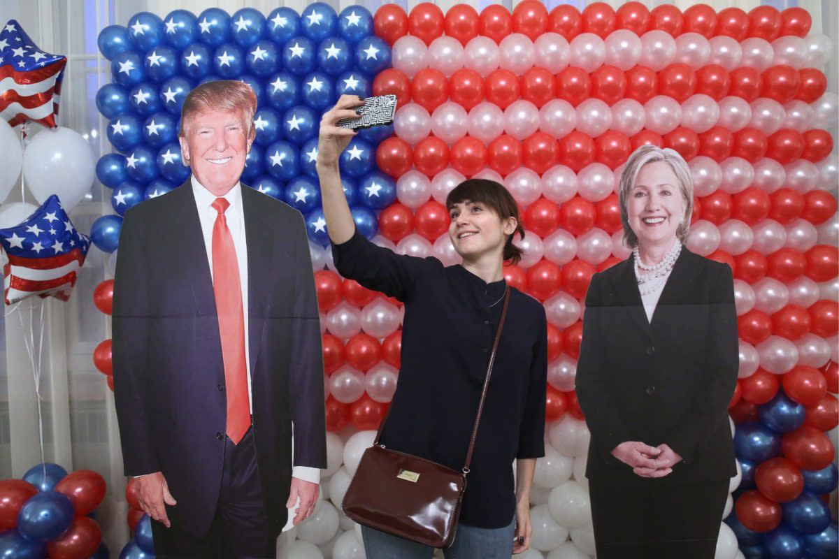 A woman takes a selfie at a reception at Spaso House, the residence of the U.S. Ambassador to Russia, on Election Day. Photo from Getty Images