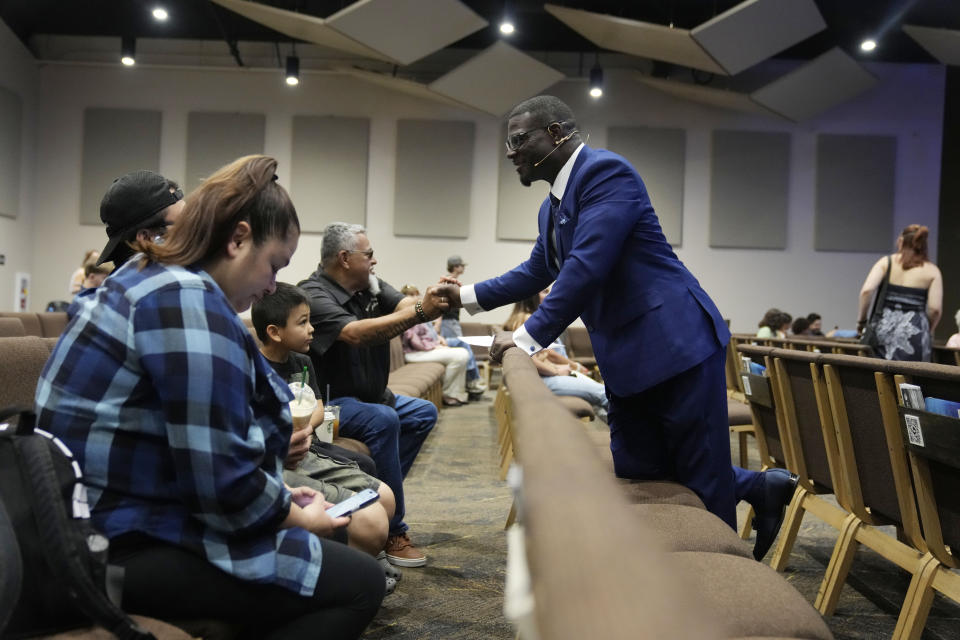 Pastor Les Robinson interacts with members of the congregation at The Sanctuary Church Sunday, May 14, 2023, in Santa Clarita, Calif. (AP Photo/Marcio Jose Sanchez)