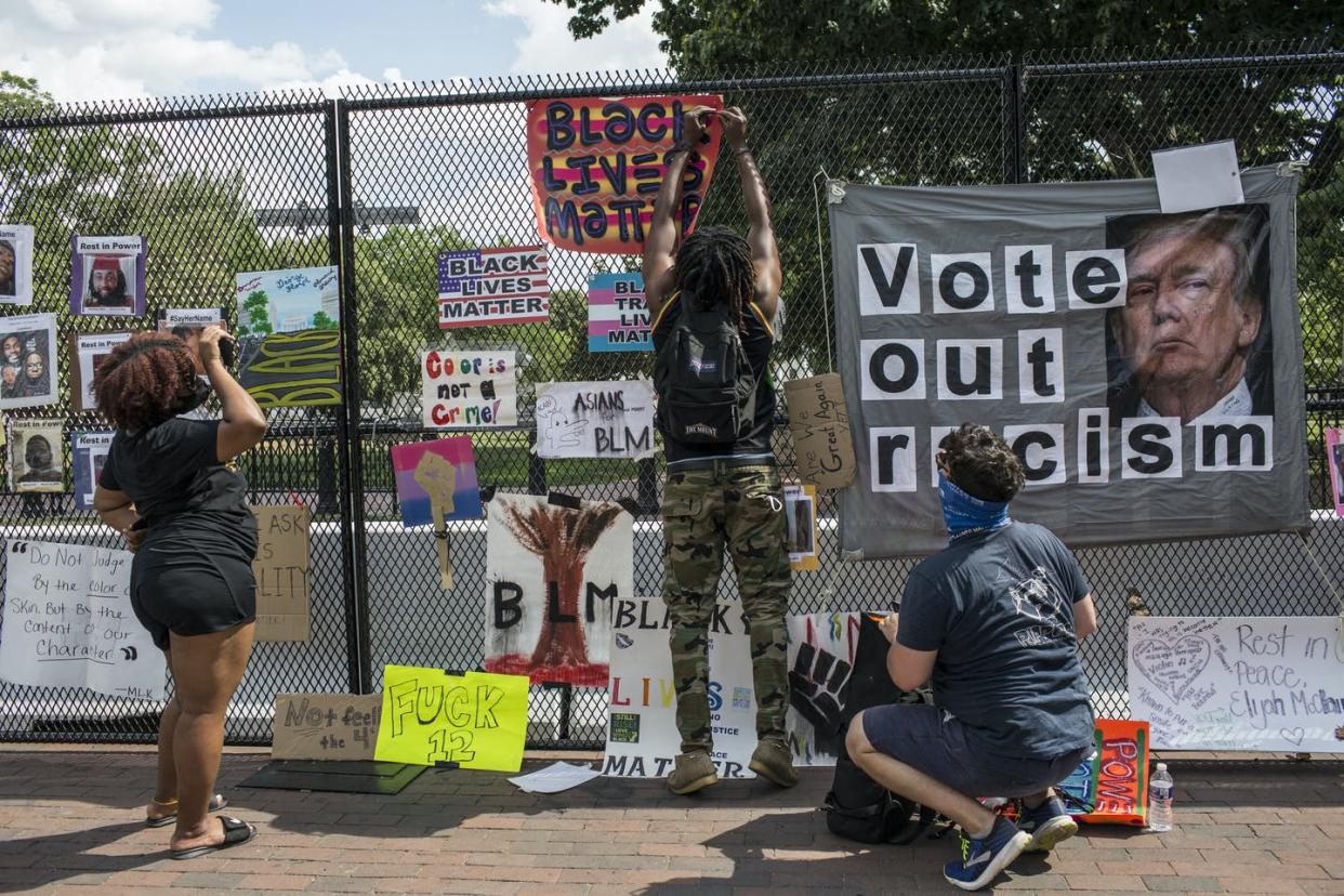 <span class="caption">George Floyd's death sparked a movement.</span> <span class="attribution"><a class="link " href="https://www.gettyimages.com/detail/news-photo/demonstrator-hanging-a-black-lives-matter-sign-on-the-fence-news-photo/1224909384?adppopup=true" rel="nofollow noopener" target="_blank" data-ylk="slk:Probal Rashid/LightRocket via Getty Images;elm:context_link;itc:0;sec:content-canvas">Probal Rashid/LightRocket via Getty Images</a></span>