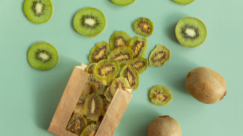 Kiwi chips next to fresh kiwi