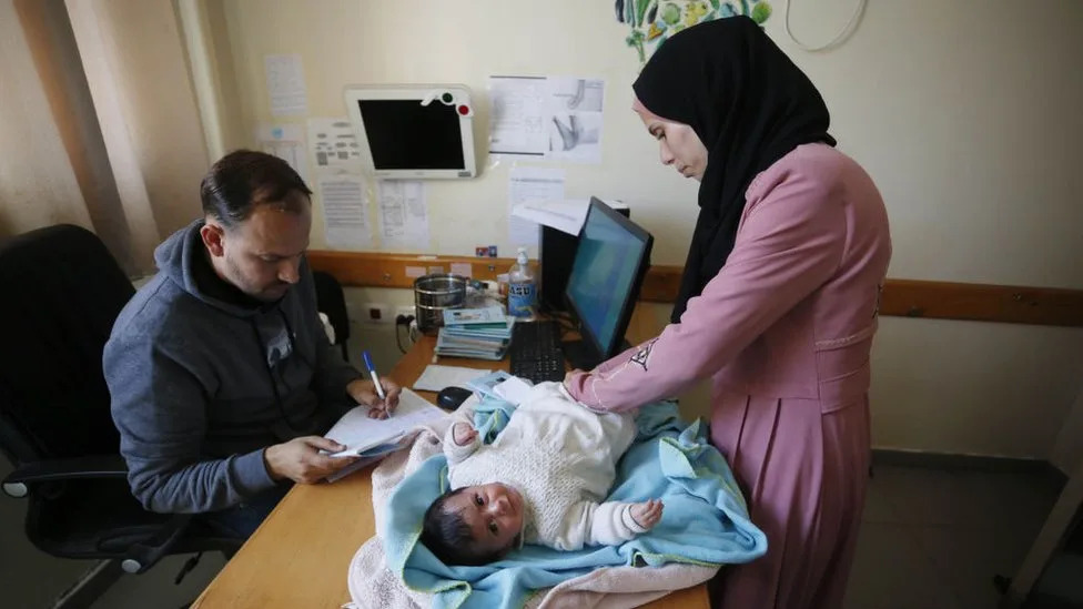 Palestinian patients gather at the UNRWA health center to receive medicines as the Israeli attacks continue in Deir Al-Balah, Gaza on January 21, 2024.