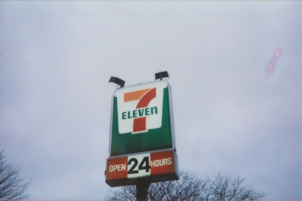 7-Eleven open 24-hr sign