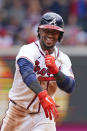 Atlanta Braves' Ozzie Albies (1) reacts after driving in a run with a double in the seventh inning of a baseball game against the Washington Nationals, Thursday, June 3, 2021, in Atlanta. (AP Photo/John Bazemore)