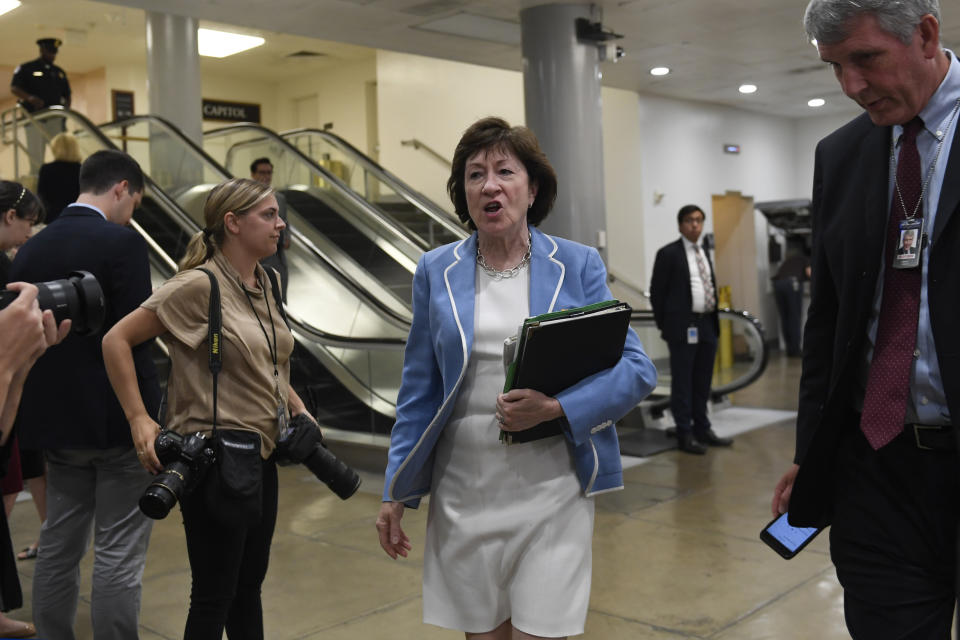 FILE - In this July 10, 2019, file photo, Sen. Susan Collins, R-Maine, walks past reporters on Capitol Hill in Washington, as she heads to a briefing on election security. National money is already flowing into Maine’s 2020 Senate race, offering the latest indicator that incumbent Collins faces a stiff reelection fight. (AP Photo/Susan Walsh, File)