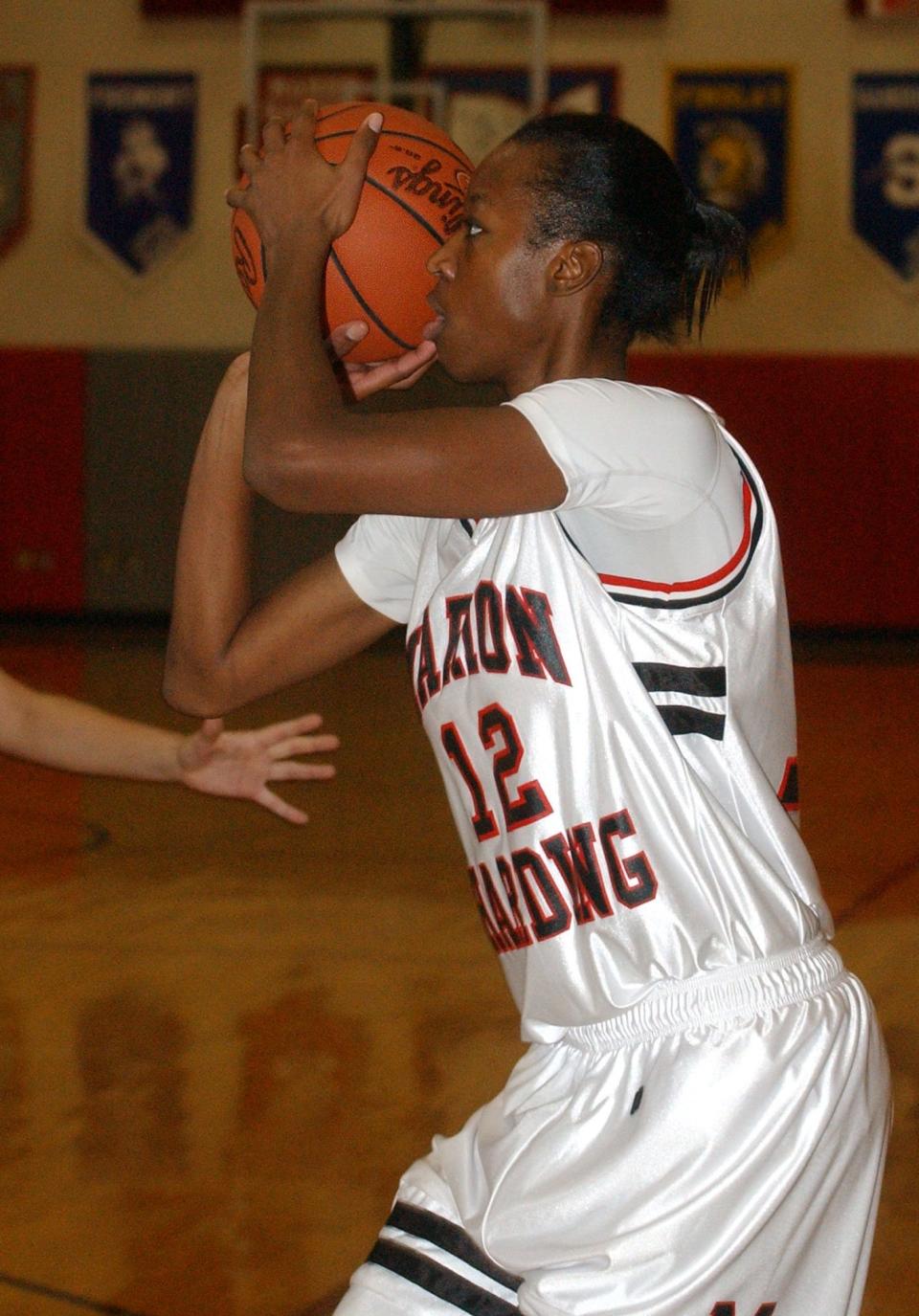 Harding High School senior Shawnta' Dyer gets set to shoot during a game against the Highland Fighting Scots. Dyer is a member of the 30th induction class for the Marion Harding High School Athletic Hall of Fame.