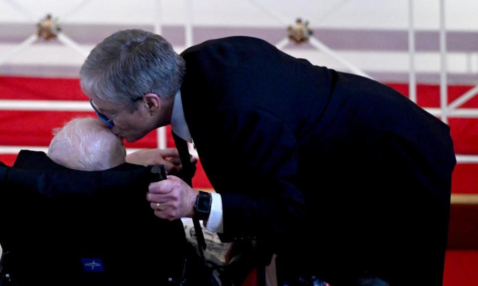 James ‘Chip’ Carter kisses the head of his father, Jimmy Carter, at the service.