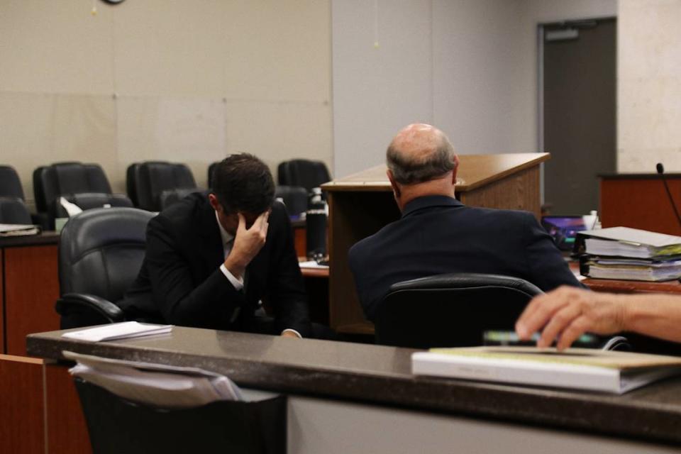 San Luis Obispo County Deputy Ditrict Attorney Chris Peuvrelle, left, speaks with defense attorney Robert Sanger in Monterey County Superior Court in Salinas on Sept. 26, 2022. Sanger’s client, Paul Flores, is on trial for the 1996 murder of Kristin Smart.