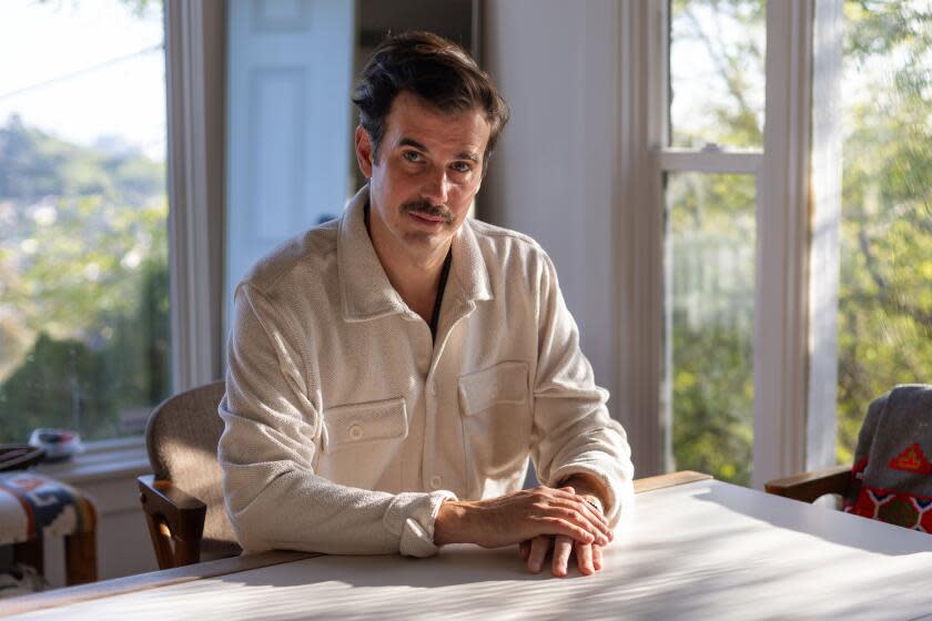 Los Angeles, CA - February 28: Michael Lockshin, a Russian-American film director who recently adapted the classic Russian novel, The Master and Margarita, for the screen, poses for a portrait at his home on Wednesday, Feb. 28, 2024 in Los Angeles, CA. (Jason Armond / Los Angeles Times)