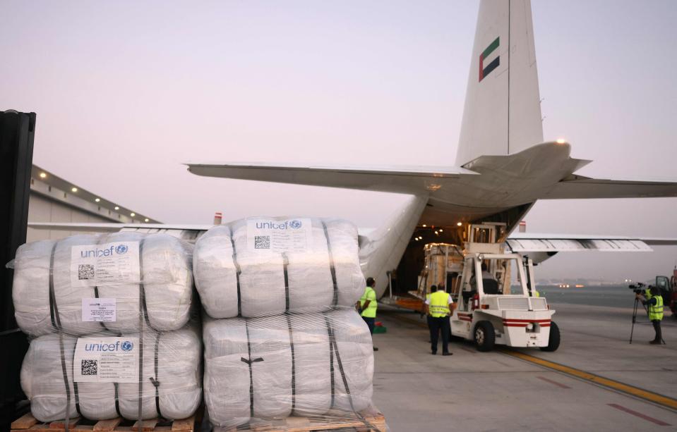 An Emirates cargo plane is loaded with aid for the Palestinian Gaza Strip at the airport in Dubai before flying to the Egypt-Gaza border city of el-Arish, in Egypt's north Sinai Peninsula on October 17, 2023, amid the ongoing battles between Israel and the Palestinian group Hamas.