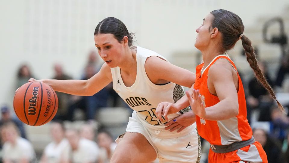 Lapel Bulldogs Madelyn Poynter (21) rushes up the court against Hamilton Heights Huskies Ella Hickok (2) on Tuesday, Dec. 19, 2023, during the game at Lapel High School in Lapel. The Hamilton Heights Huskies defeated the Lapel Bulldogs, 53-41.