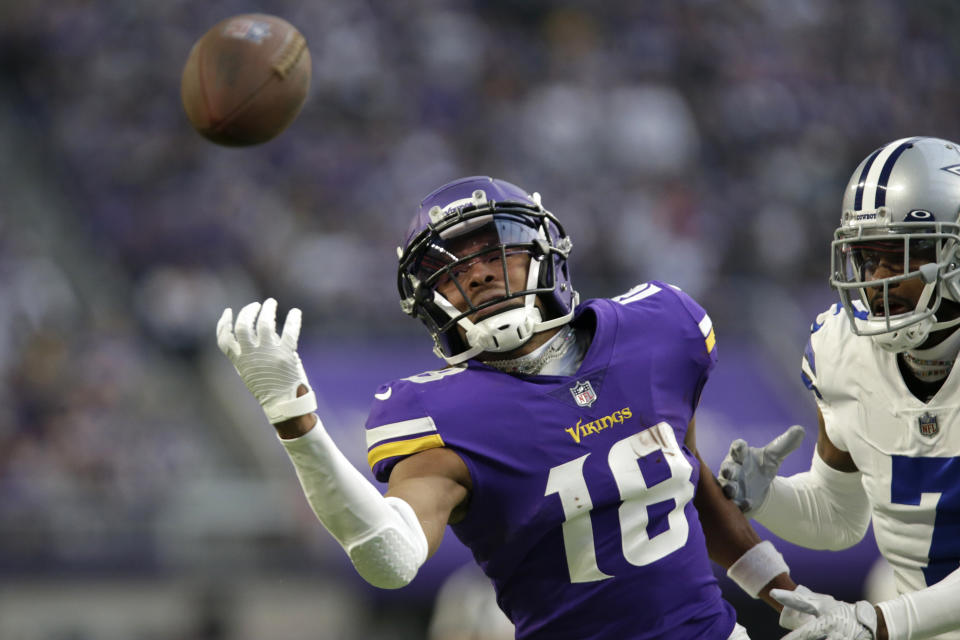 Minnesota Vikings wide receiver Justin Jefferson (18) looks to catch a pass ahead of Dallas Cowboys cornerback Trevon Diggs (7) during the first half of an NFL football game, Sunday, Nov. 20, 2022, in Minneapolis. The pass was incomplete. (AP Photo/Andy Clayton-King)