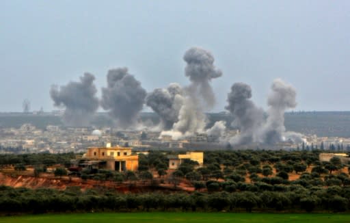 Smoke billows over the village of Qaminas, about 6 kilometres southeast of Idlib city, following reported Syrian air strikes on Monday