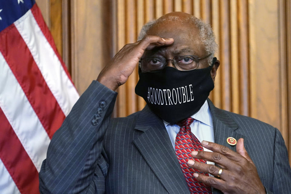 FILE - In this Sept. 17, 2020, file photo, House Majority Whip James Clyburn of South Carolina shields his eyes from a television light to look at a reporter asking a question during a news conference with House Speaker Nancy Pelosi on Capitol Hill. Clyburn and other Democrats blamed rhetoric about defunding local police departments for the party’s surprise loss of seats in the House. (AP Photo/Jacquelyn Martin, File)