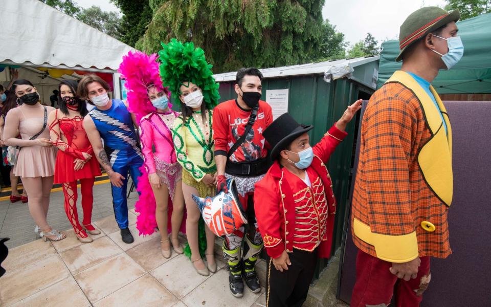 Members of the touring Zippo Circus attend a vaccination clinic in Finchley, North London