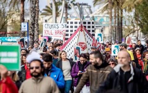 In April 2018 protesters made a stand against cruise tourism in Barcelona - Credit: Getty