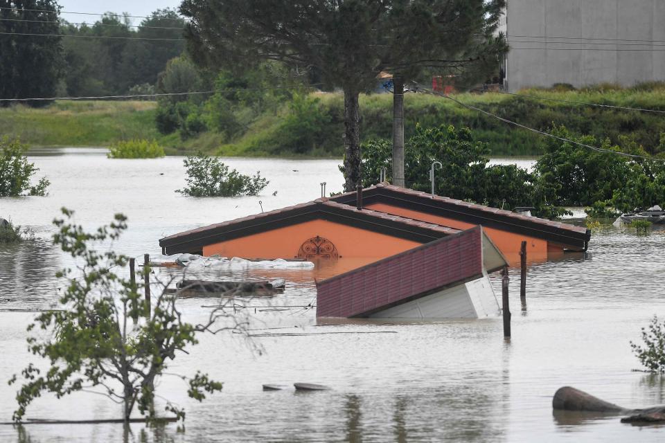 Flooded bungalows are pictured in Cesena on May 17, 2023 after heavy rains caused major floods in central Italy. Trains were stopped and schools were closed in many towns while people were asked to leave the ground floors of their homes and to avoid going out, and at least eight people have died after the floods across Italy's northern Emilia Romagna region.