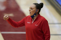 FILE - In this Feb. 22, 2021, file photo, Arizona head coach Adia Barnes gestures toward players during the first half of her team's NCAA college basketball game against Stanford in Stanford, Calif. Coaches and players throughout the Pac-12 knew well before last season's NCAA Tournament they had one of the most talented conferences in the country. For sixth-year Arizona coach Adia Barnes, she is challenging her team in Tucson not to relish in that runner-up finish given how good the Pac-12 still is and how hard it will be to get back there and triumph this time. (AP Photo/Jeff Chiu, File)