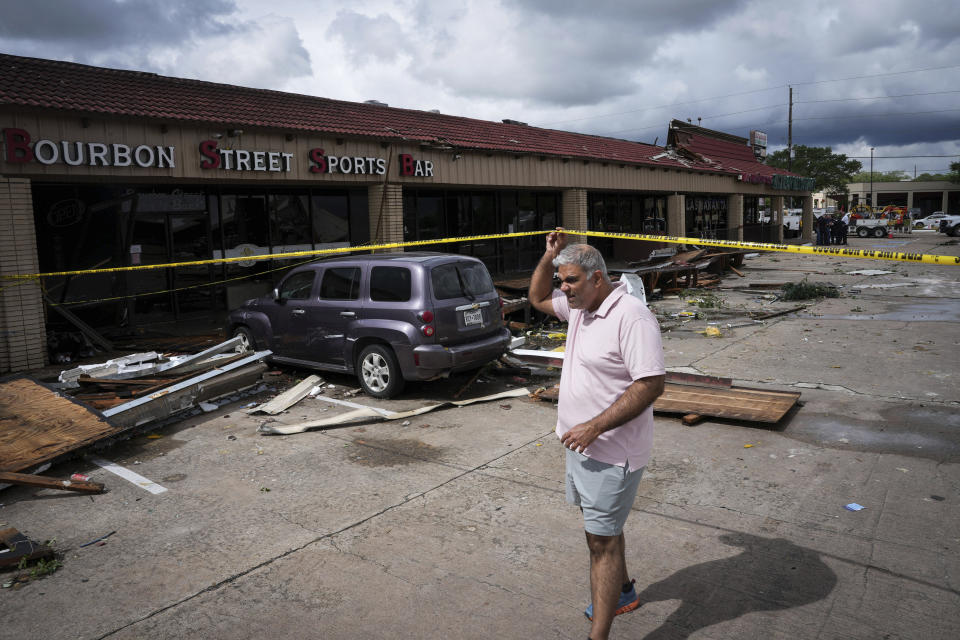 Sumit Bhasin surveys damage to his furniture store caused by a tornado Wednesday, April 10, 2024, in Katy, Texas. He had two vendors visiting. "Unfortunately, this is what I have to show them," he said. (Jon Shapley/Houston Chronicle via AP)