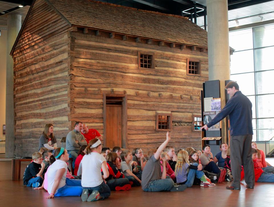 At the National Underground Railroad Freedom Center in Cincinnati in 2011, students learn about a slave pen moved from a farm in Mason County, Ky.