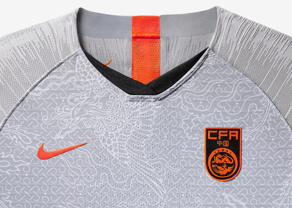<p>China’s new away shirt carries a brilliant all-over Phoenix print conveying femininity and virtue. Crimson pops on the sleeve enliven the gray tonal body, and a second Phoenix print sits within the kit as a symbol of inner pride. </p>