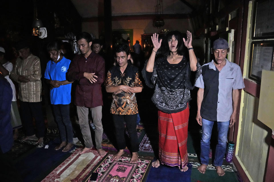 Trans women and activists perform an early evening prayer at Al-Fatah Islamic school in Yogyakarta, Indonesia, Sunday, Nov. 6, 2022. On the outskirts of the Indonesian city that's home to many universities, the small boarding school is on a mission that seems out of place in a nation with more Muslim citizens than any other. Its students are transgender women. (AP Photo/Dita Alangkara)