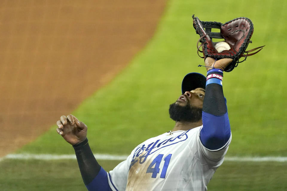 Kansas City Royals first baseman Carlos Santana catches a fly foul ball for an out against Tampa Bay Rays' Yandy Diaz during the seventh inning of a baseball game Monday, April 19, 2021, in Kansas City, Mo. (AP Photo/Charlie Riedel)