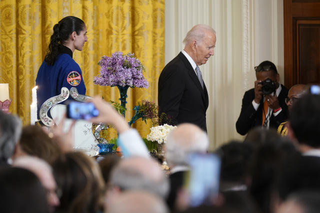 President Joe Biden and NASA astronaut Lt. Col. Jasmin Moghbeli leave the stage during a Nowruz celebration in the East Room of the White House, Monday, March 20, 2023, in Washington. (AP Photo/Evan Vucci)