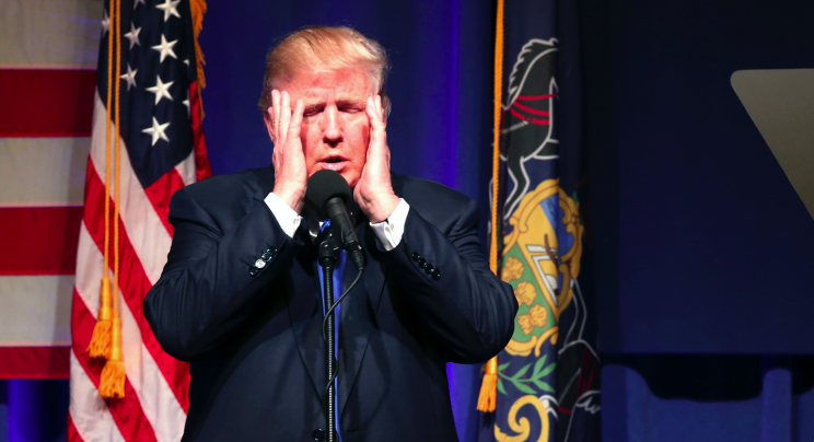 Then-Republican presidential candidate Donald Trump holds his head in his hands as he speaks during a campaign rally Monday, Nov. 7, 2016, in Scranton, Pa. (AP Photo/Mel Evans)