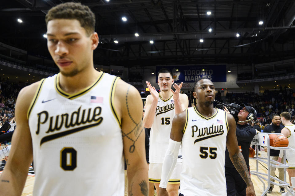 Purdue center Zach Edey (15) celebrates with his teammates after Purdue defeated Alabama 92-86 in an NCAA college basketball game in Toronto, Saturday, Dec. 9, 2023. (Christopher Katsarov/The Canadian Press via AP)