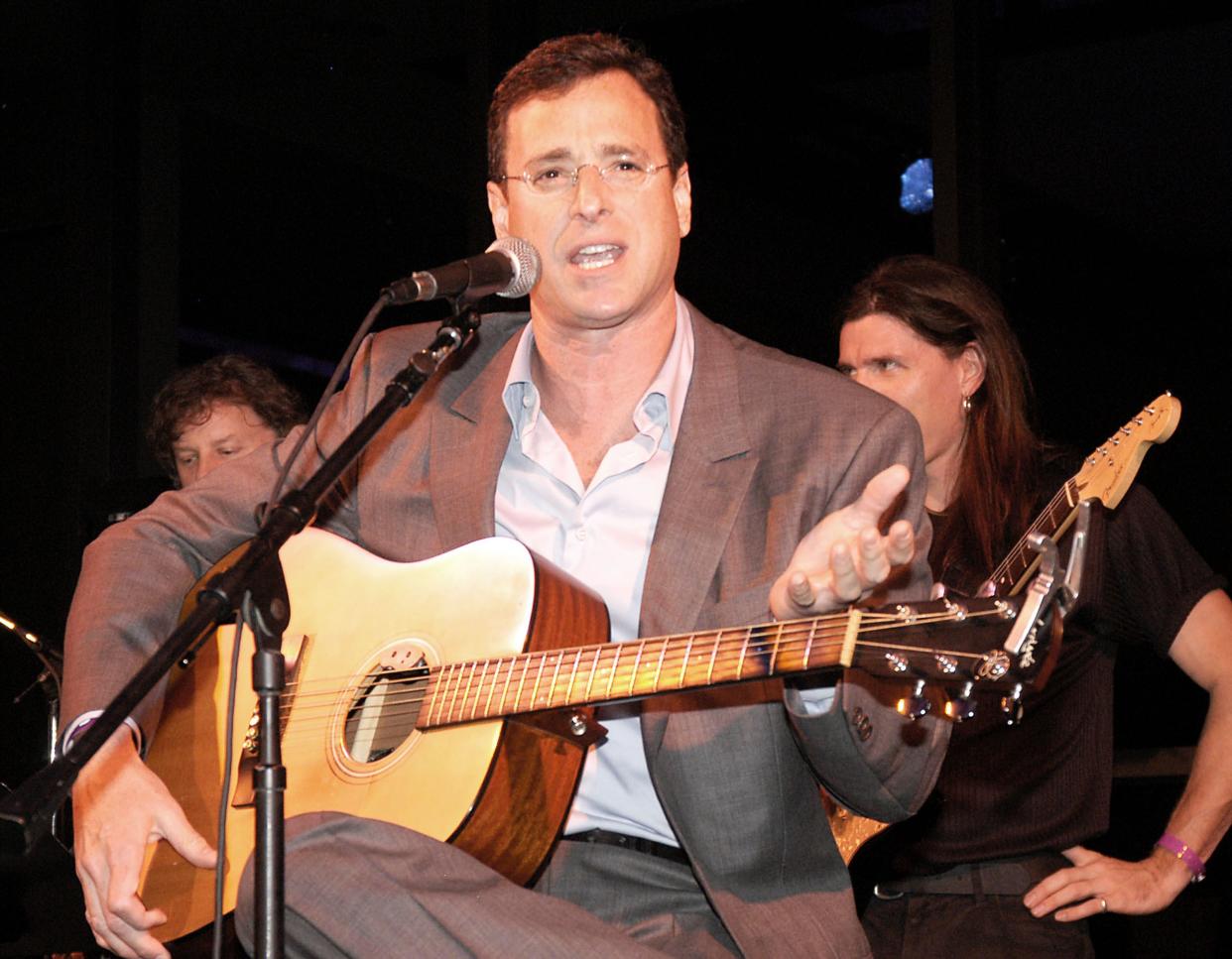 Actor Bob Saget performs at the 20th Anniversary Starlight Children's Foundation Gala on May 10, 2003, in Hollywood, Calif.