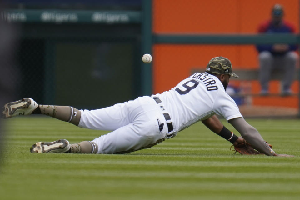 Detroit Tigers' Willi Castro dives but can't reach a Chicago Cubs' Ian Happ fly ball in the fourth inning of a baseball game in Detroit, Sunday, May 16, 2021. (AP Photo/Paul Sancya)