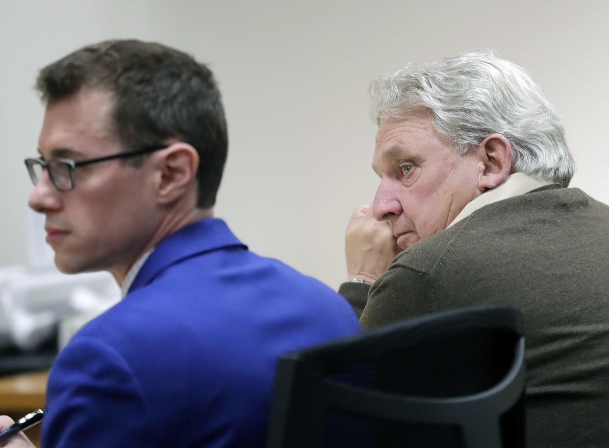 Grand Chute Town Supervisor Ron Wolff, right, listens to opening statements with defense attorney, Nathan Otis, during his trial Outagamie County Circuit Court on Wednesday in Appleton. Wolff is charged with having private interest in a public contract, a Class I felony, for accepting a landscaping contract with Grand Chute while serving as a member of the town board.