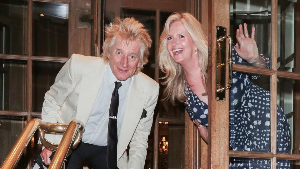 Rod Stewart and wife Penny Lancaster strike a pose as they leave The Ritz in London