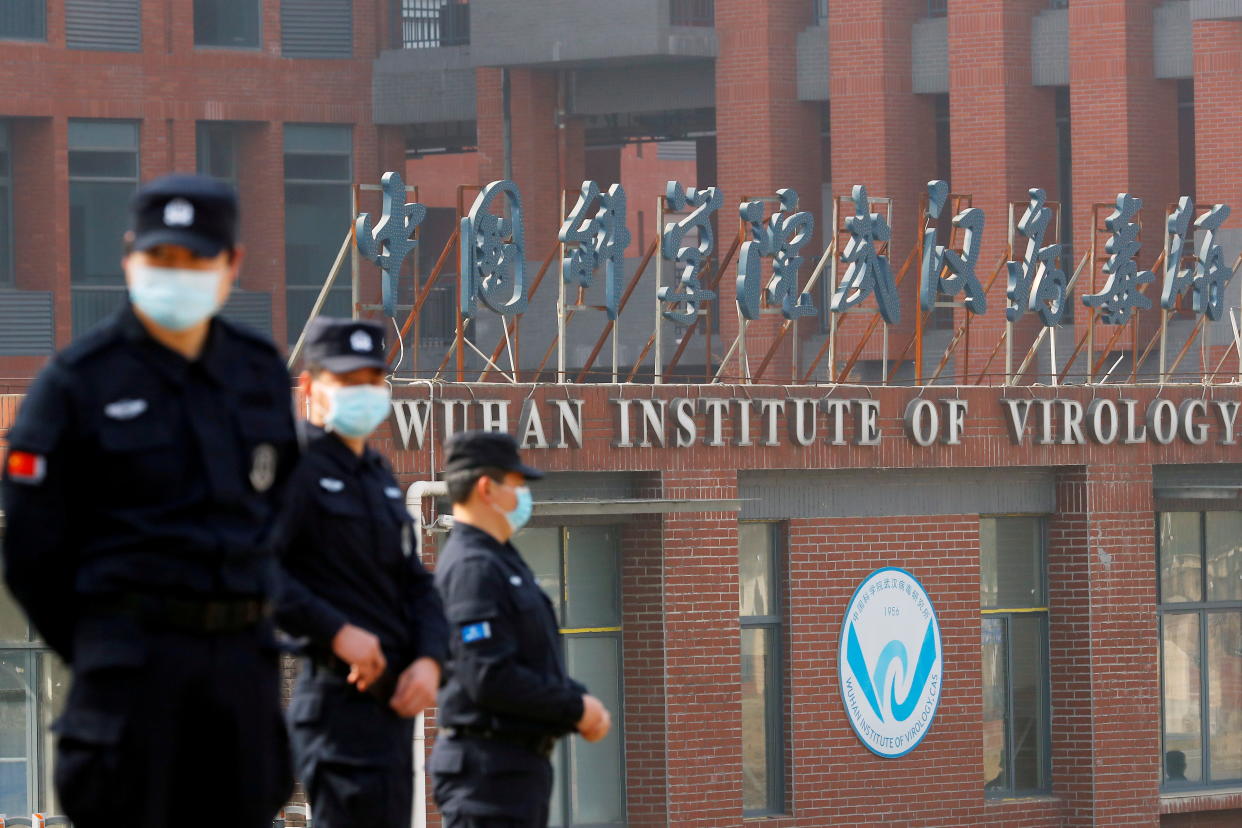 Security personnel keep watch outside the Wuhan Institute of Virology 